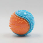 Dog training ball toy with blue and orange textured halves, squeaky design