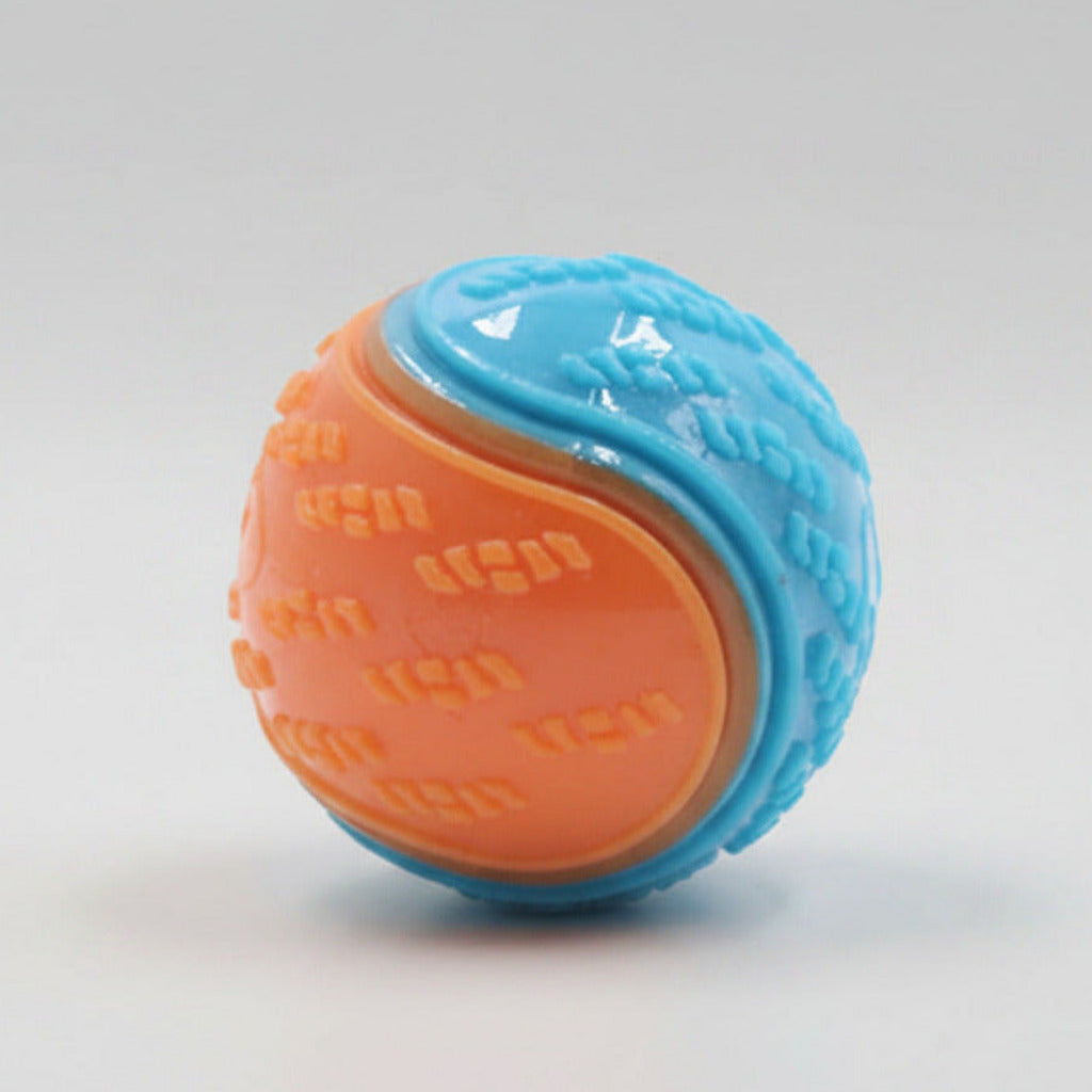 Dog training ball toy with blue and orange textured halves, squeaky design