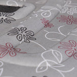 Gray pet carrier fabric with white and red floral line pattern, close-up