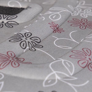 Gray pet carrier fabric with white and red floral line pattern, close-up