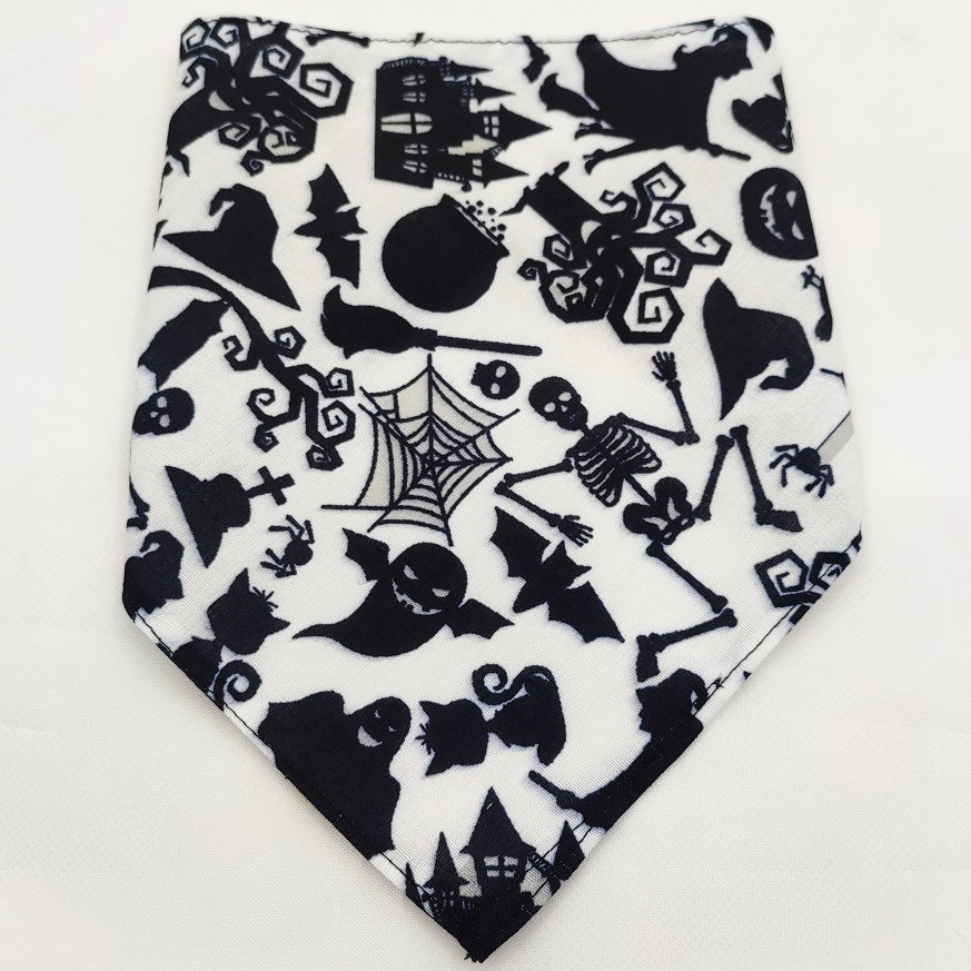 Pet triangle bandana in black and white with Halloween cats, spiderwebs, bats, and stars