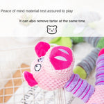 Pink plush pig sound toy with embroidered face and striped arms and legs