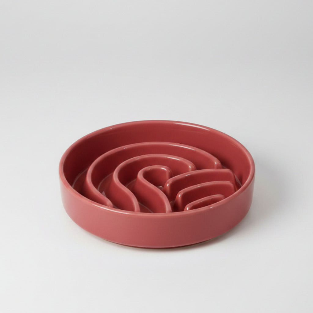 Pink/red wave slow feeder dog bowl with wavy channels inside, no stand