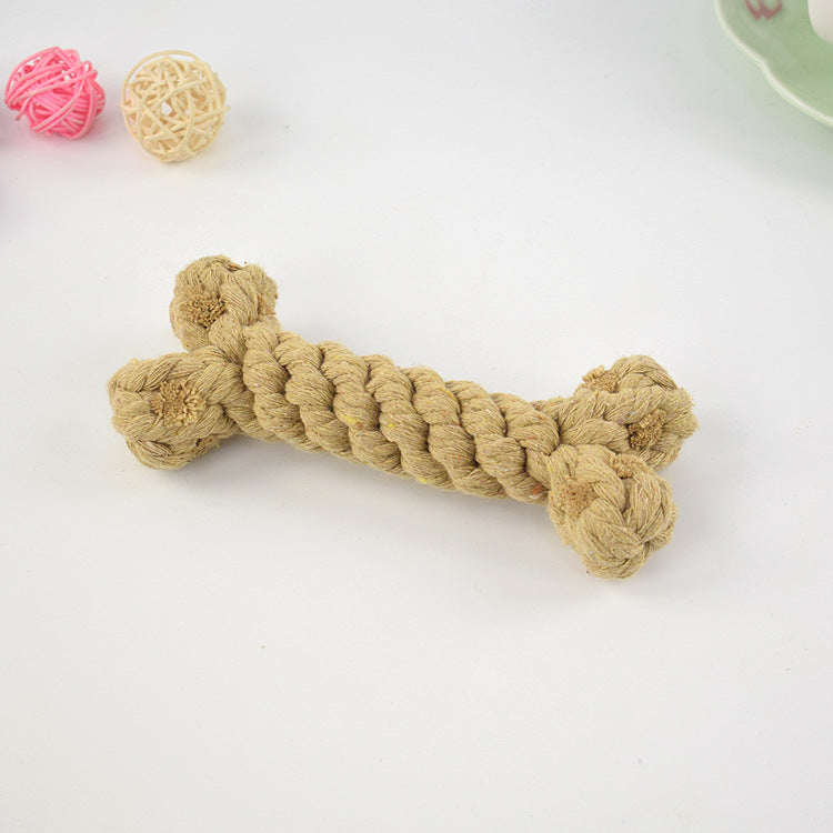 Tan crocheted dog bone toy with knotted ends