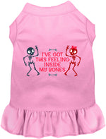 Light pink sleeveless pet dress with ruffled hem and skeleton graphic on front