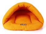 Orange pet cave sleeping bag with cushioned inner bed and logo patch