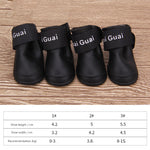 Black dog soft-soled pet shoes with wide "Guai" label straps
