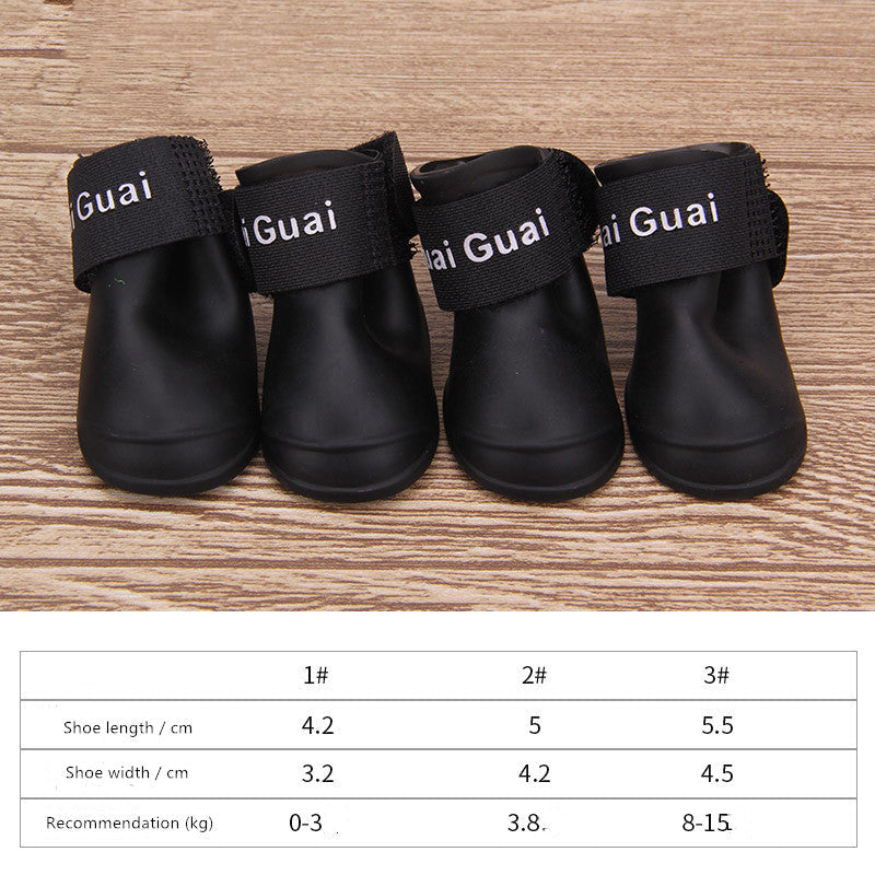 Black dog soft-soled pet shoes with wide "Guai" label straps