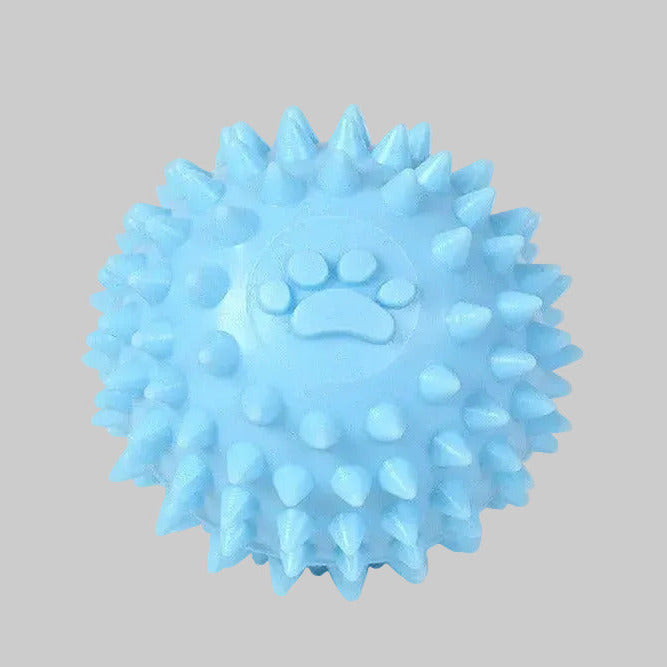 Light blue spiky dog throwing ball with raised paw print