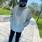 Adult hooded reflective-letter windbreaker, light gray-blue, front zip, elastic cuffs