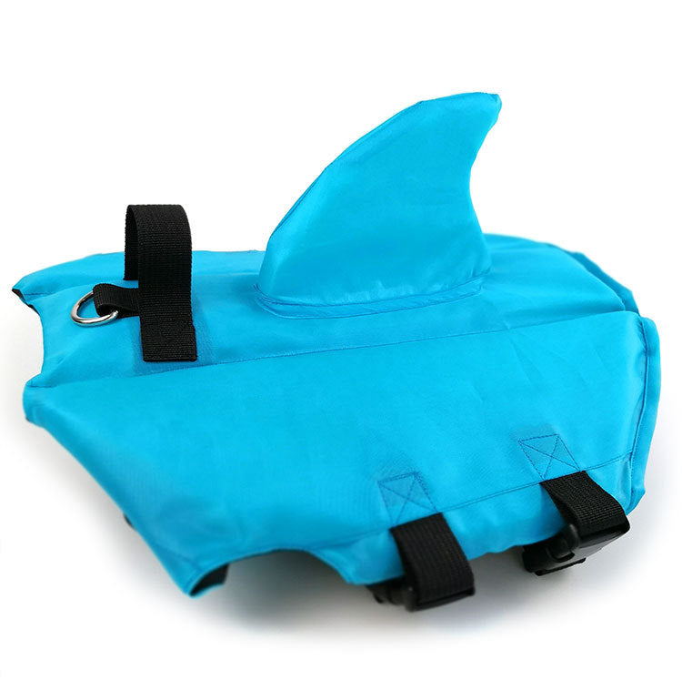 Blue dog swim suit close-up with flotation hood, black straps, and loop handle