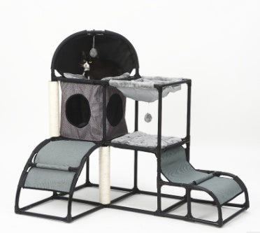 Cat climbing tree condo with gray fabric platforms, tunnel pod, and covered top dome.