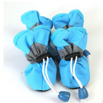 Blue soft dog boots with lace-up cords and grippy sole, small pull tabs