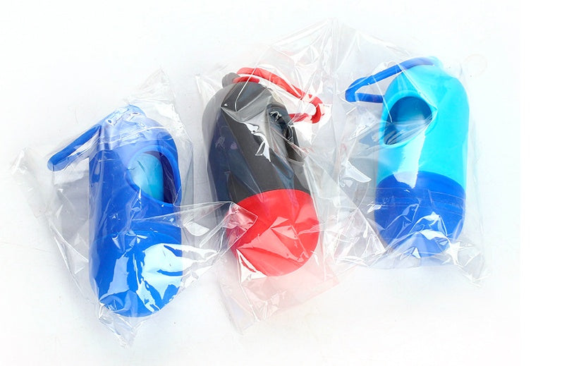Packaged pet waste bag dispensers with trash bag rolls in blue, red, and black