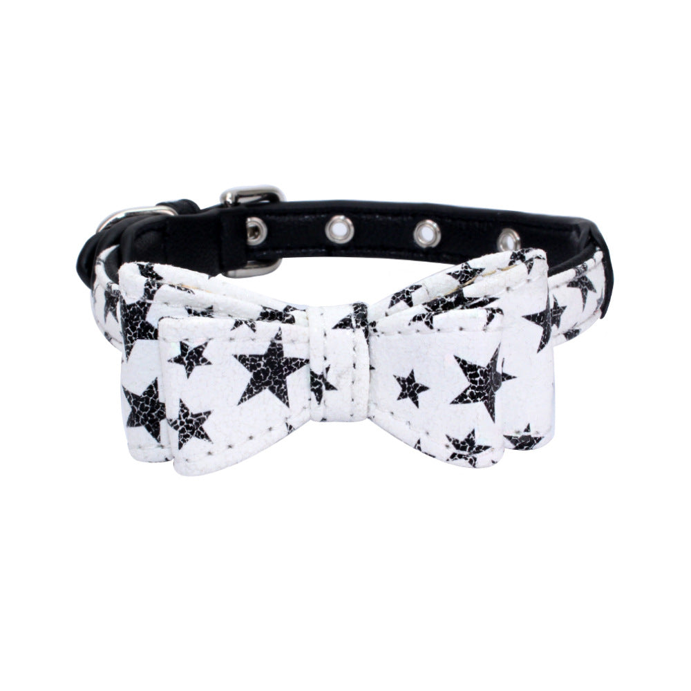 Pet collar with black-and-white star print strap and bow, black stars, silver grommet studs
