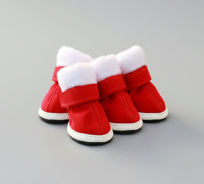 Red pet Christmas shoes set with white fuzzy cuffs and Velcro straps, three boots