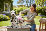 2-in-1 silicone pet washing brush with pink shampoo dispenser, rubber bristles