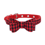 Pet collar with red strap and red plaid bow, black grid pattern, silver grommet studs