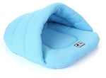 Sky blue pet cave sleeping bag with padded interior and logo patch