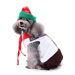 Elf dog costume with green hat, red headband, white cape, and brown curled pants