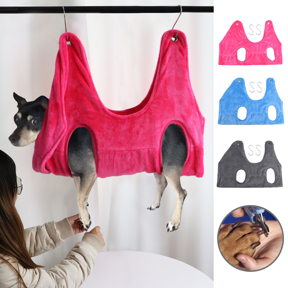 Pink pet grooming hammock restraint bag with four leg openings and hanging loops