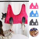 Pink pet grooming hammock restraint bag with four leg openings and hanging loops