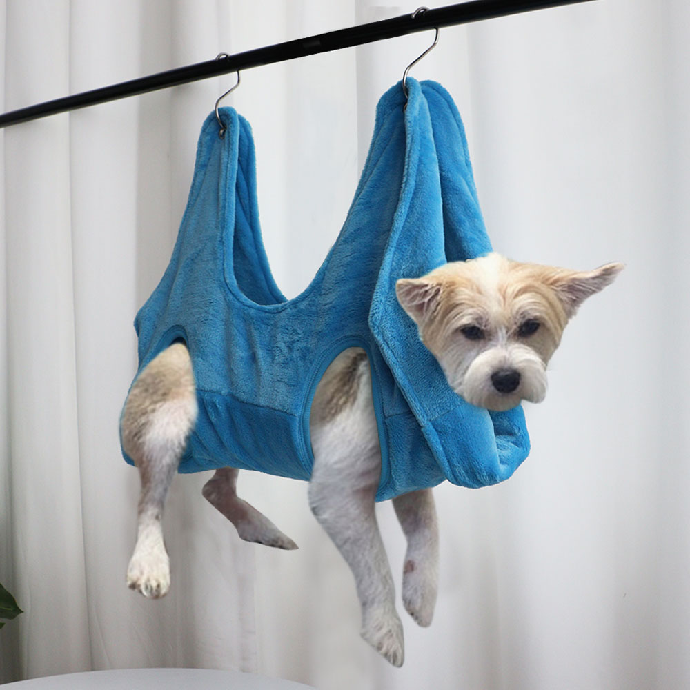 Blue pet grooming hammock restraint bag with four leg openings and hanging loops