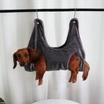 Dark pet grooming hammock restraint bag with four leg openings and hanging loops