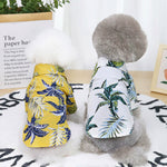 White tropical-print cotton dog shirt with green leaves, short sleeves