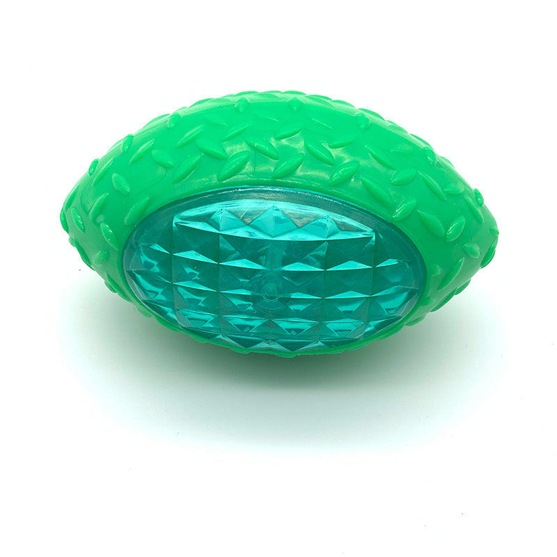 Green bite-resistant rugby training ball dog toy with textured grip and diamond top