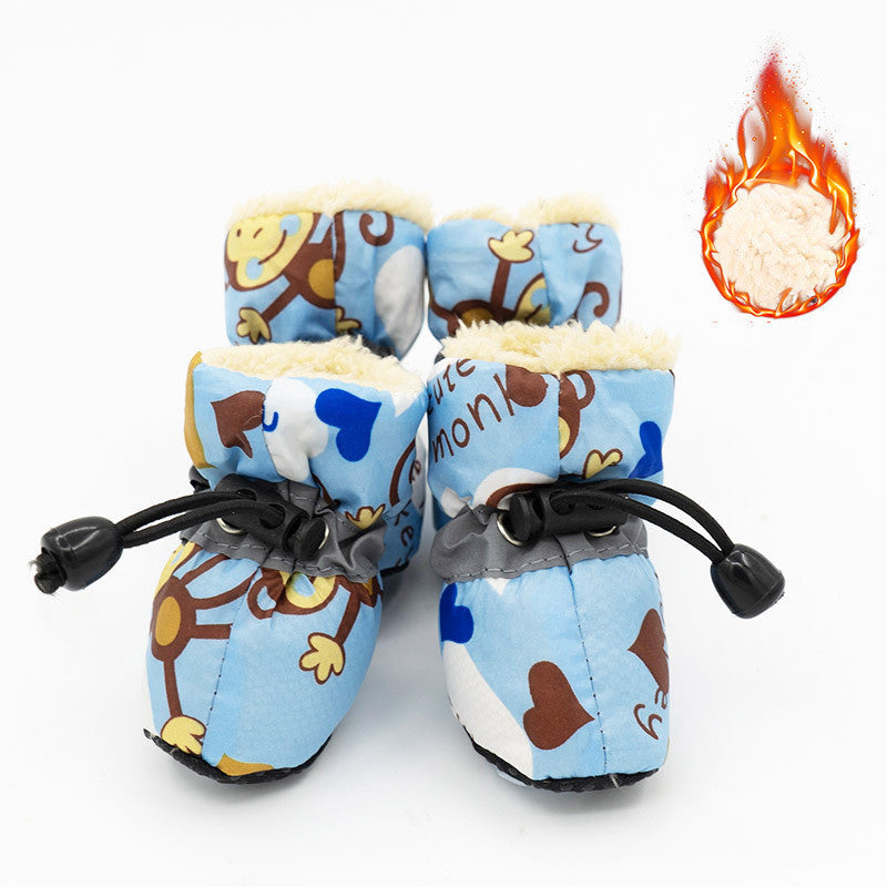 Blue dog rain boots with cartoon print, black drawcord straps, and warm faux-fur lining
