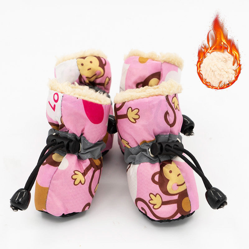 Rose-pink dog rain boots with cartoon print, black drawcord straps, and warm faux-fur lining