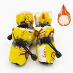 Yellow dog rain boots with cartoon print, black drawcord straps, and warm faux-fur lining