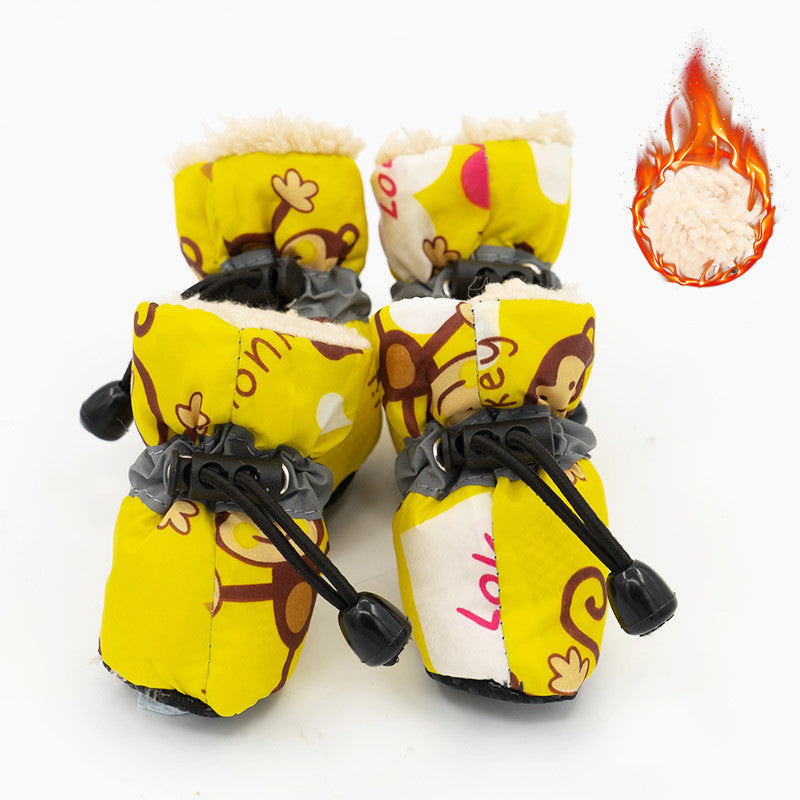 Yellow dog rain boots with cartoon print, black drawcord straps, and warm faux-fur lining