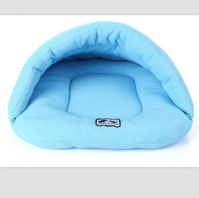 Light blue pet cave sleeping bag with plush interior and small logo patch