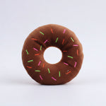 Brown plush donut dog toy with colorful sprinkles and round center hole