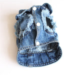 Light blue denim pet jacket with frayed trim, four-button front, and rounded hem