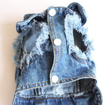 Blue denim pet jacket front with four white button closures and side pocket detail