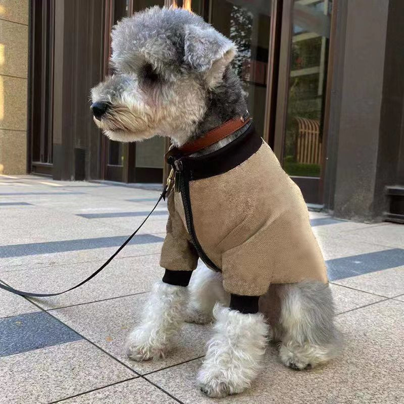 Khaki pet winter jacket hoodie with zipper and dark ribbed cuffs, side view on dog outdoors.