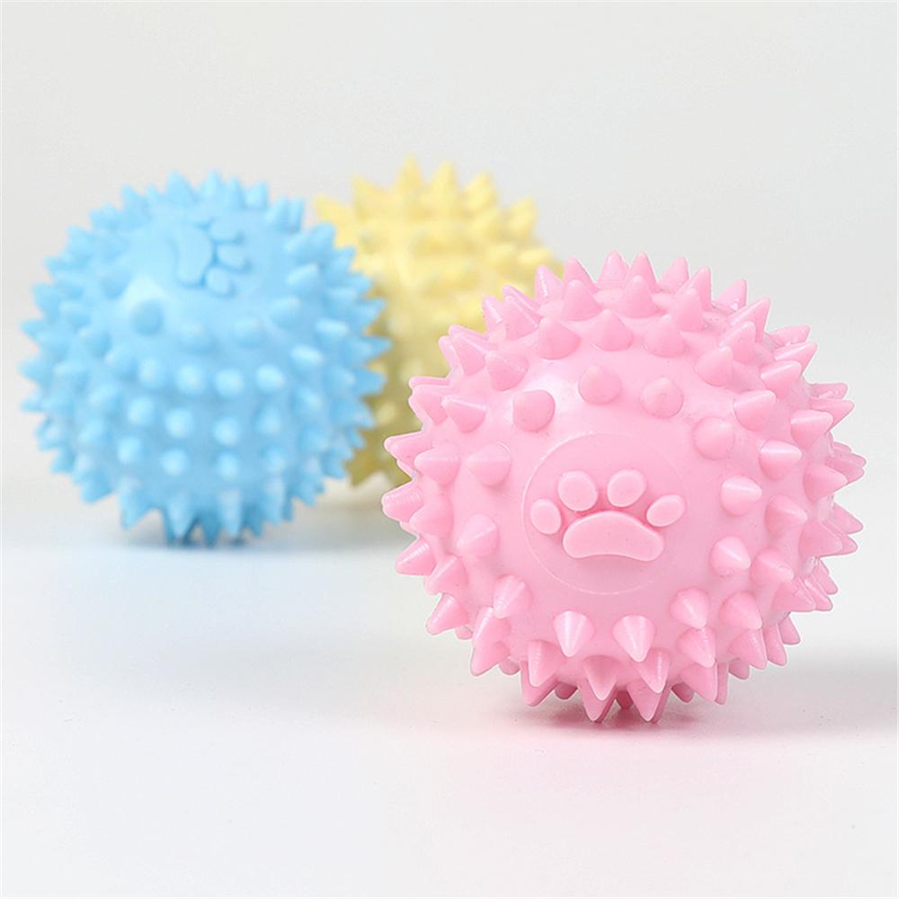 Spiky dog throwing toys with paw print detail, blue and pink