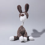 Plush rabbit toy with brown textured pattern, white belly, and long ears.