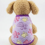 Pet fleece vest in lavender with multicolor paw and star prints