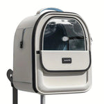 Cat carrier backpack with clear front window and side opening, light-colored body, black edge