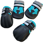 Assorted angles of blue dog shoe covers with black soles and adjustable hook-and-loop straps