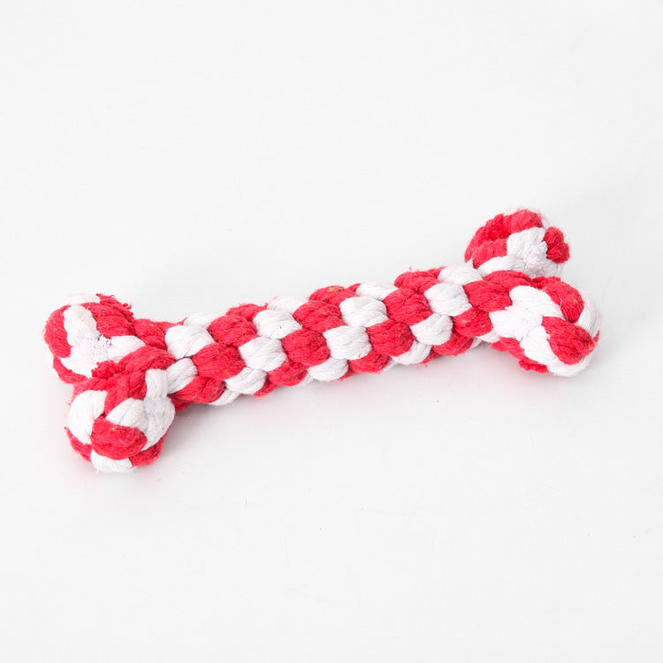 Red and white striped crocheted dog bone toy with knotted ends