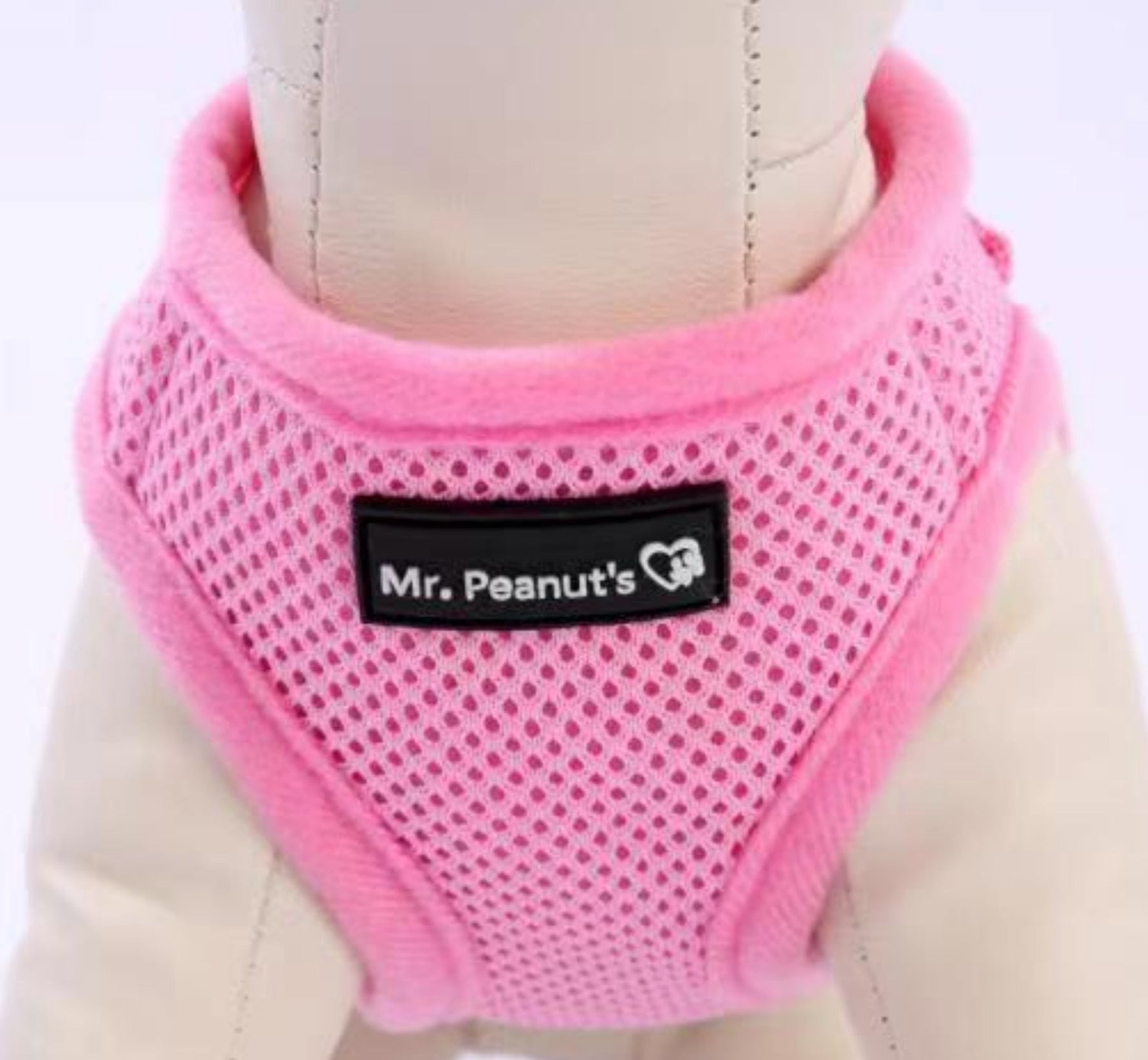 Pink mesh dog harness with black trim and Mr. Peanut's logo patch