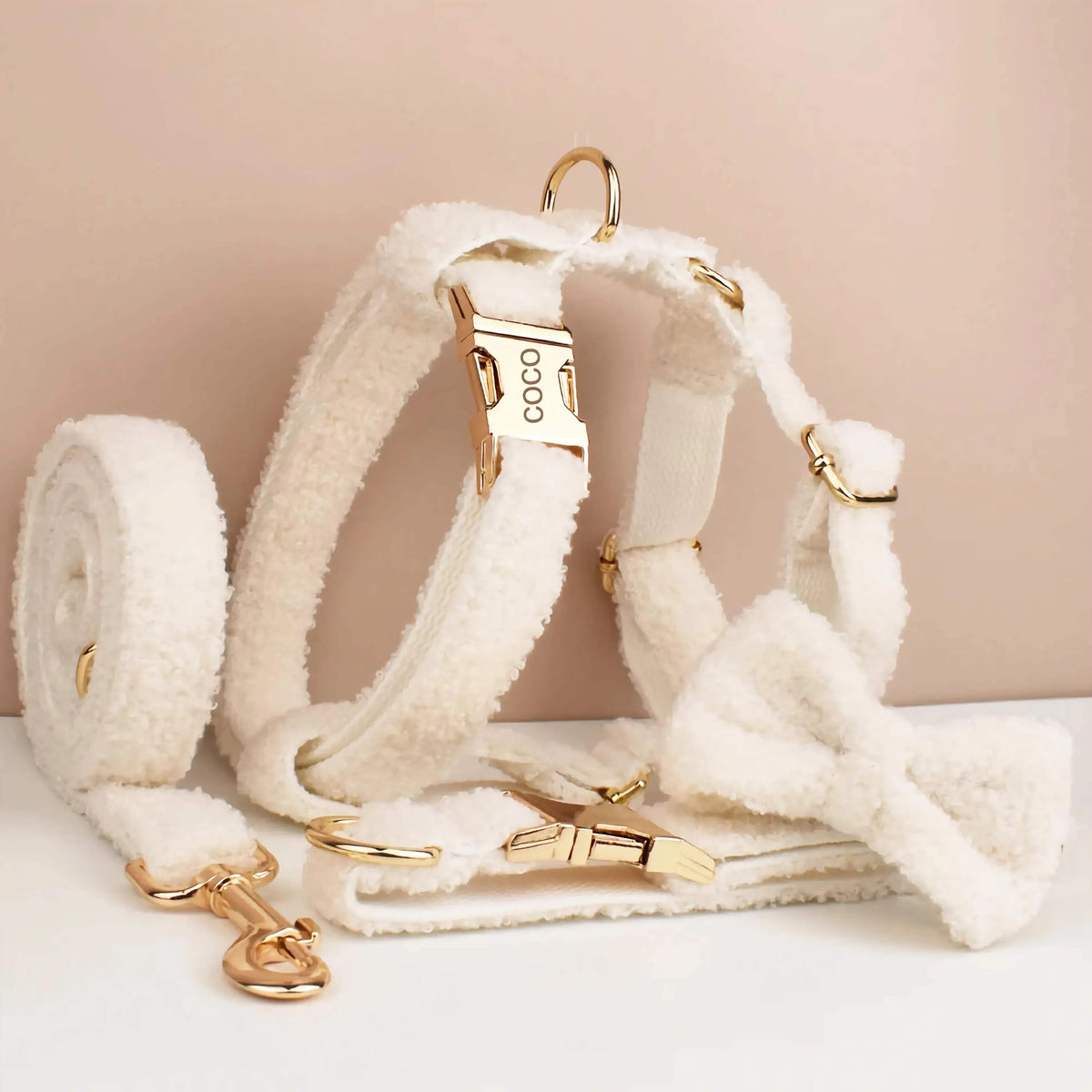Cream knitted dog collar and bowtie set with gold hardware, leash and harness pieces