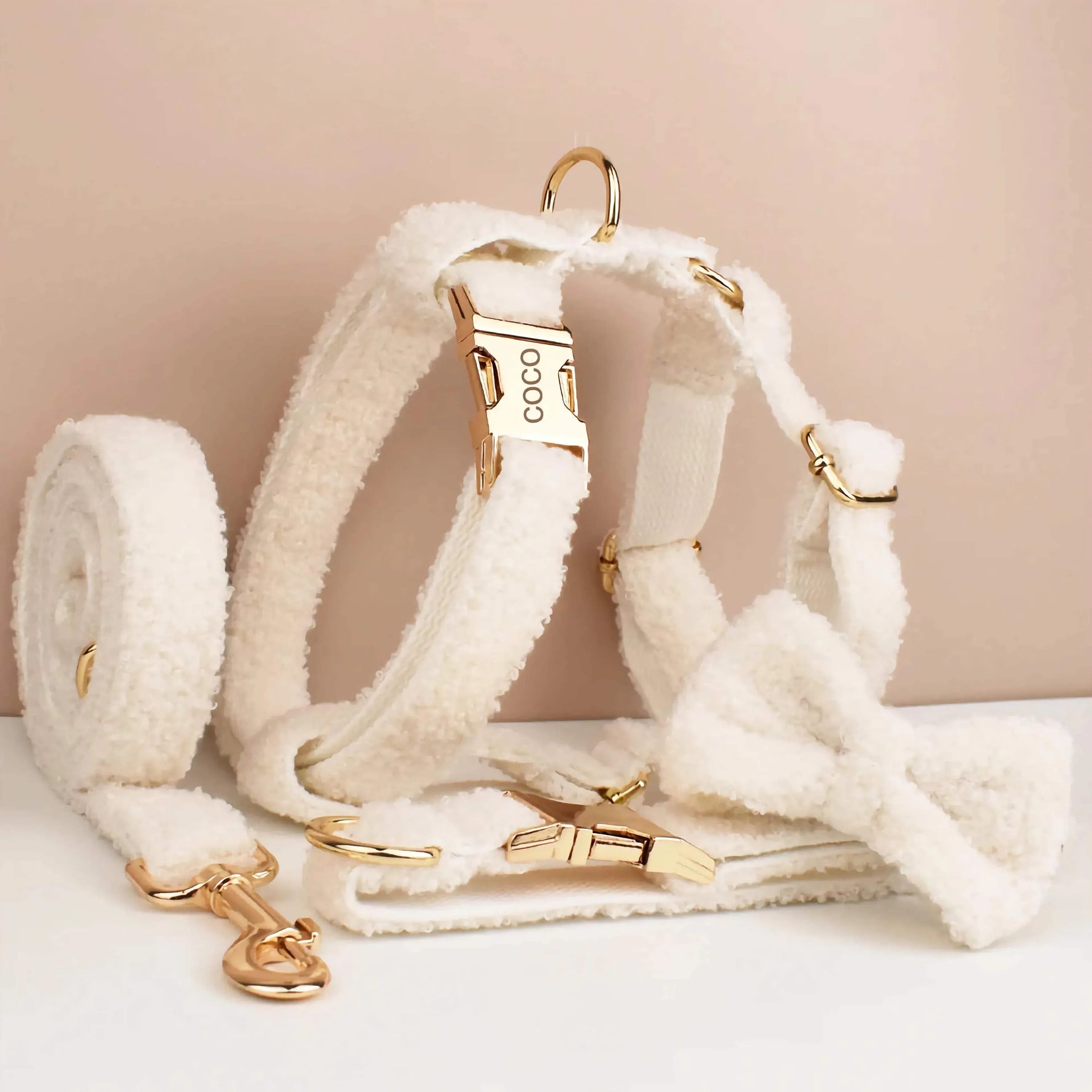 Cream knitted dog collar and bowtie set with gold hardware, leash and harness pieces