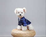 Blue satin pet pajama shirt with white trim and button front, collar style