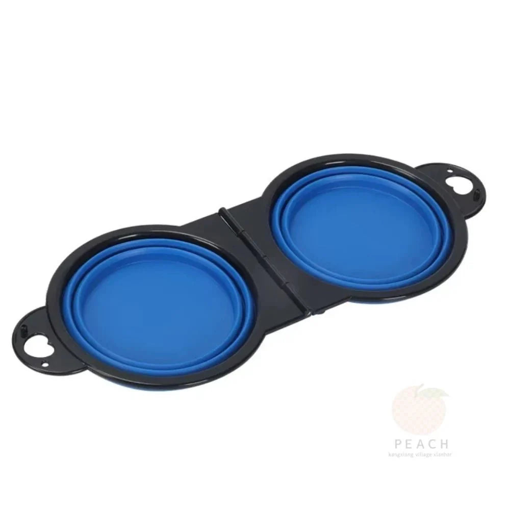 Blue foldable dual pet bowl with two round dishes in a connected frame